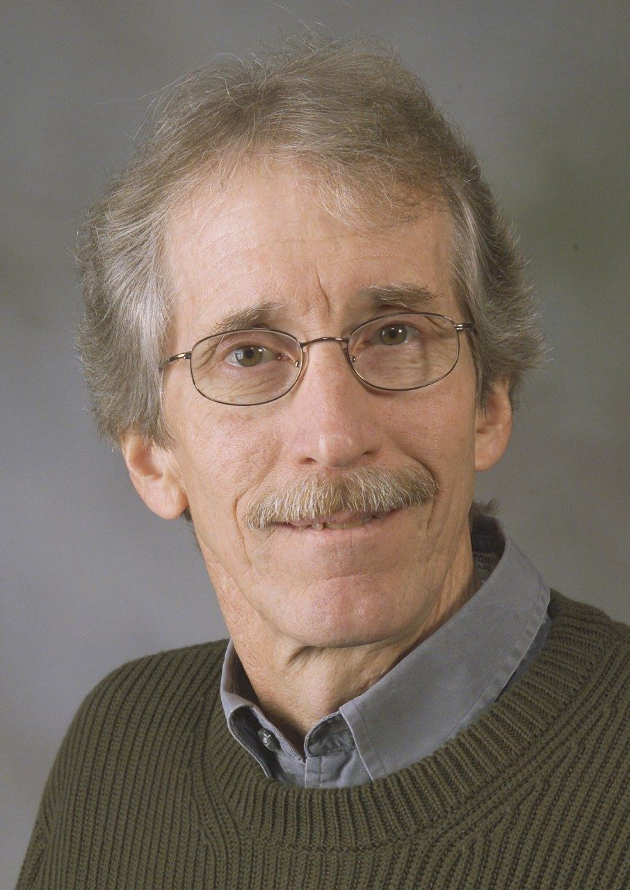 Faculty member smiling