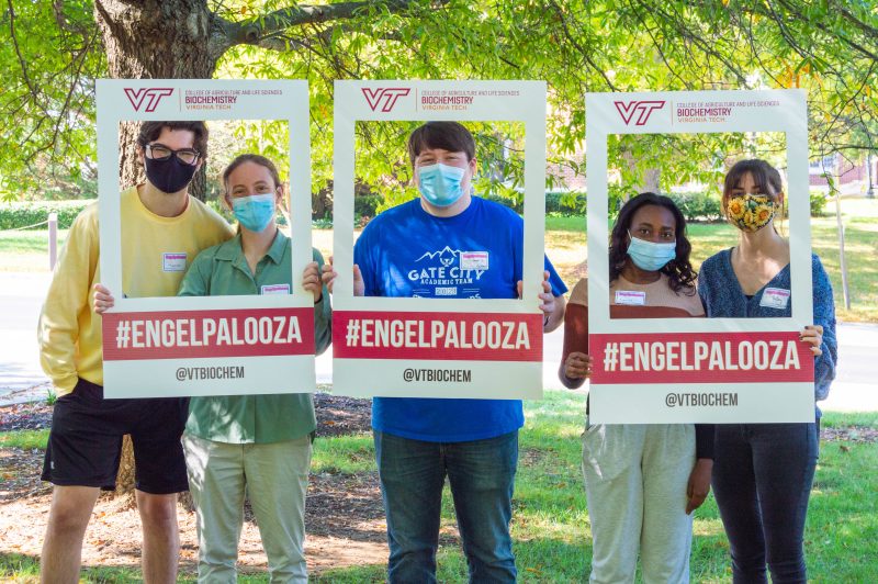 EngelPalooza 2021: Virginia Tech biochemistry graduate students pose holding cardboard Instagram frames