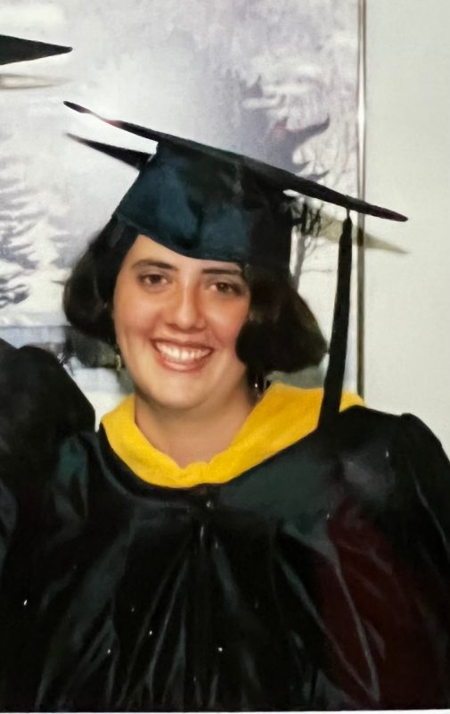 Headshot of Patty Mims in graduation regalia.