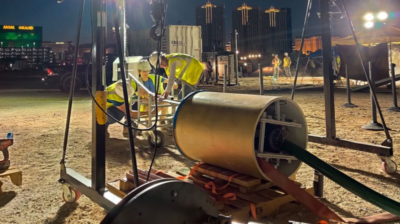 Diggeridoos team members working at night on their hole boring machine. 