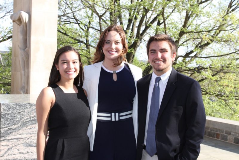 Stephanie Payne, Alexa Parsley, and Rex Willis pose at the Pylons