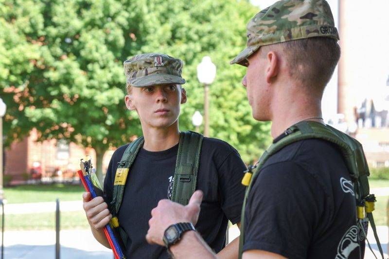 Cadets Meredith Oakes, at left, and Logan Grow, at right, talk.