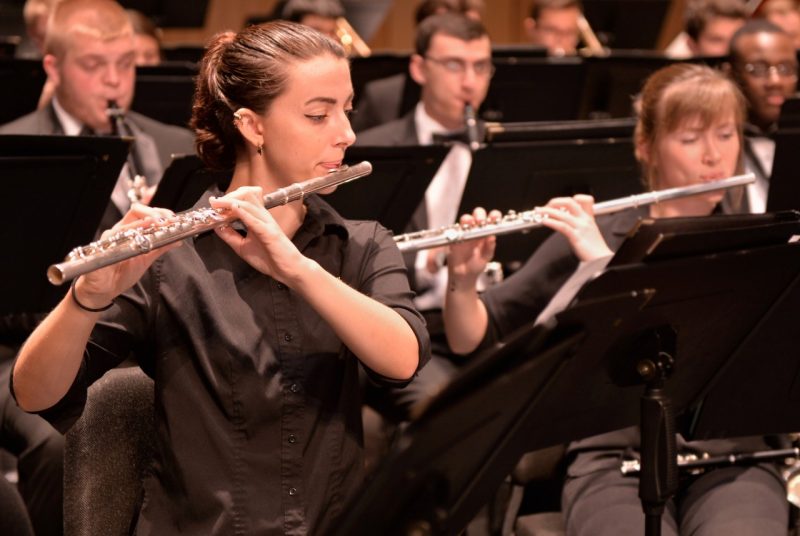 Music students from the Virginia Tech Wind Ensemble perform in a concert.