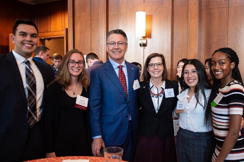 Tim Sands and Laura Sands with Beyond Boundaries scholars at a reception