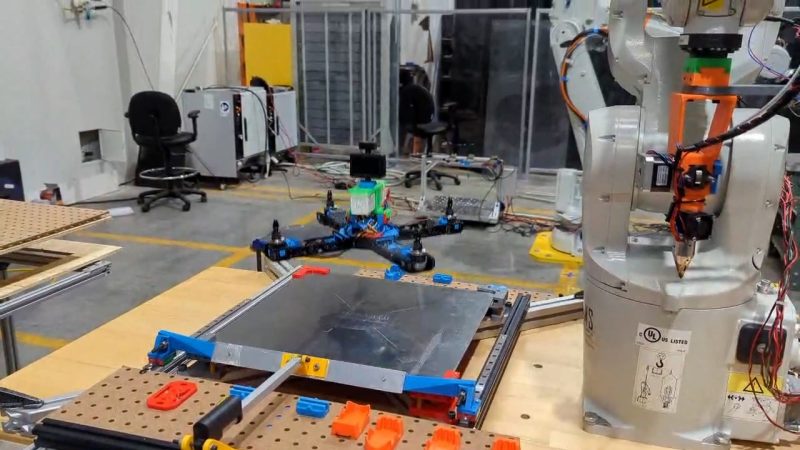 A 3D-printed, autonomously assembled drone flies away from its printer.