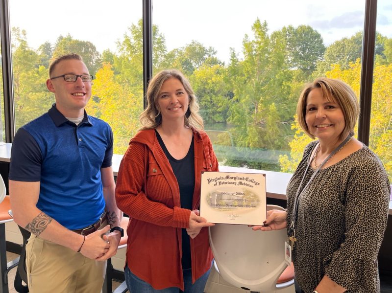 Chris Whitlock and Lynett Cruise present Sommer Dillon with her Supervisor Development Program certificate.